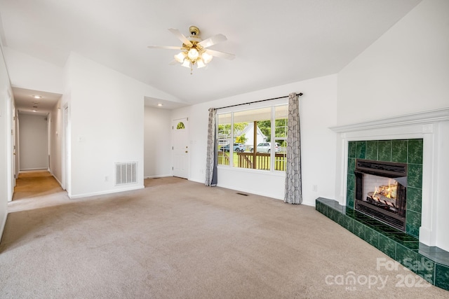 87 Collins Rd, Marshall, NC 28753 - unfurnished living room with lofted ceiling, carpet floors, ceiling fan, a tiled fireplace, and baseboards