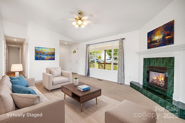 87 Collins Rd, Marshall, NC 28753 - living area featuring vaulted ceiling, a ceiling fan, and a tile fireplace