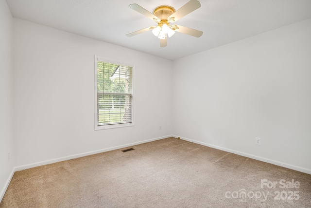 87 Collins Rd, Marshall, NC 28753 - unfurnished room with carpet flooring, baseboards, and a ceiling fan