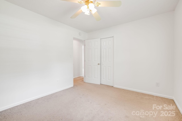 87 Collins Rd, Marshall, NC 28753 - unfurnished bedroom with carpet floors, baseboards, a closet, and ceiling fan