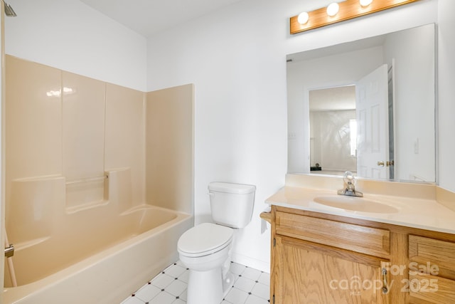 87 Collins Rd, Marshall, NC 28753 - full bathroom featuring tile patterned floors, toilet, vanity,  shower combination, and baseboards
