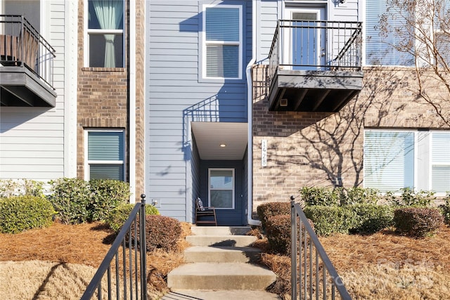 1428 Winding Stream Rd, Charlotte, NC 28206 - doorway to property with a balcony and brick siding