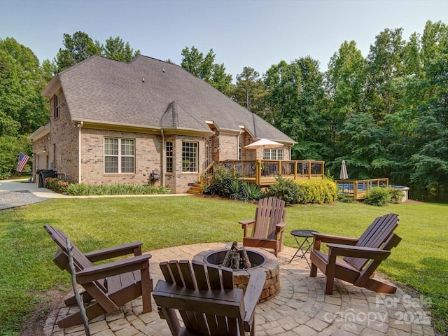 8101 Cane Pointe Ln, Waxhaw, NC 28173 - back of property featuring an outdoor fire pit, a deck, brick siding, a yard, and a patio area