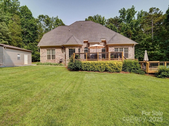 8101 Cane Pointe Ln, Waxhaw, NC 28173 - back of house with brick siding, a wooden deck, and a yard