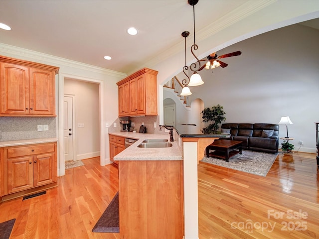 8101 Cane Pointe Ln, Waxhaw, NC 28173 - kitchen with a sink, arched walkways, a peninsula, open floor plan, and ceiling fan