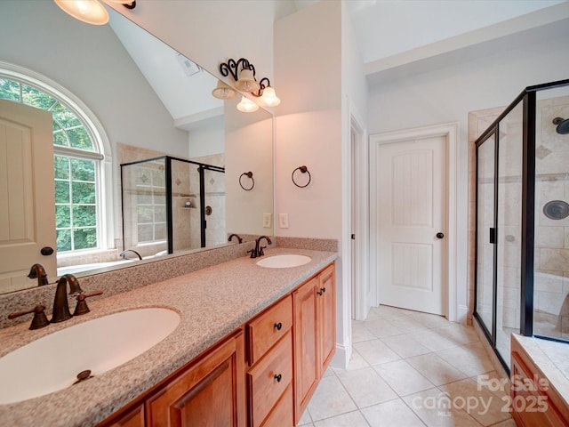 8101 Cane Pointe Ln, Waxhaw, NC 28173 - full bath with double vanity, a stall shower, tile patterned flooring, and high vaulted ceiling