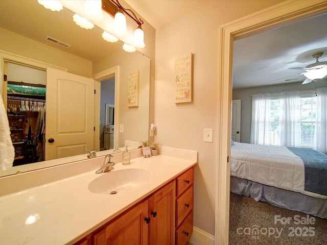 8101 Cane Pointe Ln, Waxhaw, NC 28173 - bathroom featuring vanity, ceiling fan, and baseboards