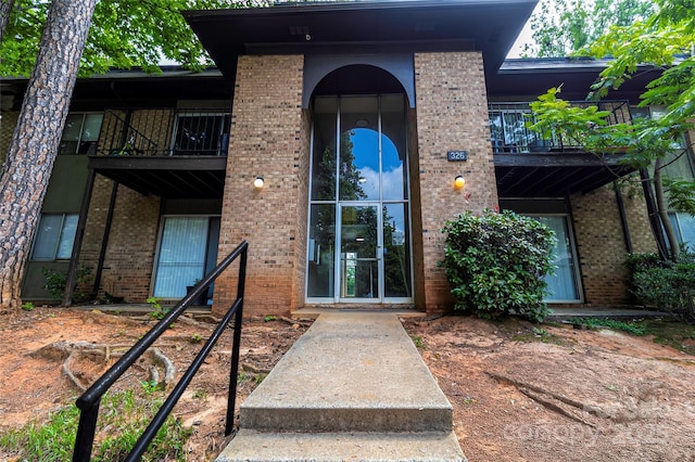 326 Orchard Trace Ln Unit 3, Charlotte, NC 28213 - entrance to property with a balcony and brick siding