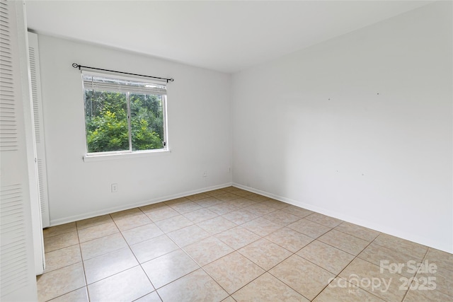 326 Orchard Trace Ln Unit 3, Charlotte, NC 28213 - spare room with light tile patterned floors and baseboards