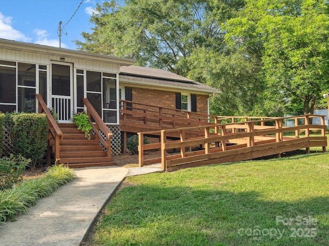 1238 Carl Allen Rd, Edgemoor, SC 29712 - view of front of property with a sunroom, a front yard, brick siding, and a deck