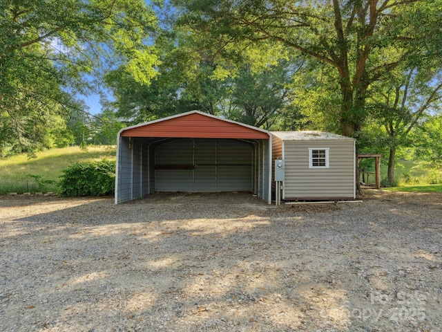 1238 Carl Allen Rd, Edgemoor, SC 29712 - garage featuring driveway and a carport