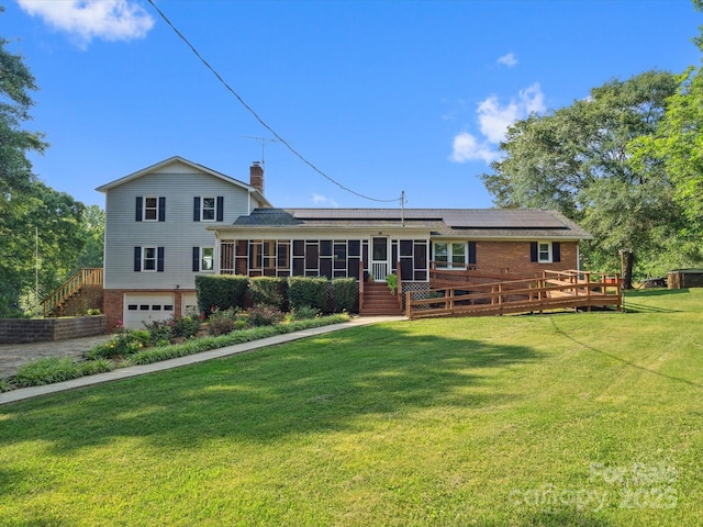 1238 Carl Allen Rd, Edgemoor, SC 29712 - back of property featuring a sunroom, roof mounted solar panels, a chimney, a garage, and stairs