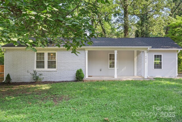 4410 Burgin St, Kannapolis, NC 28081 - ranch-style house with a front yard, brick siding, and a shingled roof