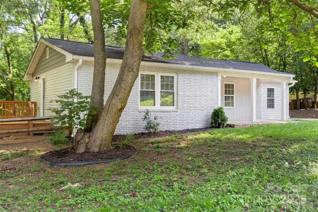 4410 Burgin St, Kannapolis, NC 28081 - view of front facade featuring brick siding and a deck