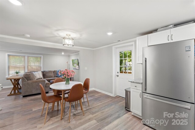 4410 Burgin St, Kannapolis, NC 28081 - dining space with ornamental molding, light wood-type flooring, and recessed lighting