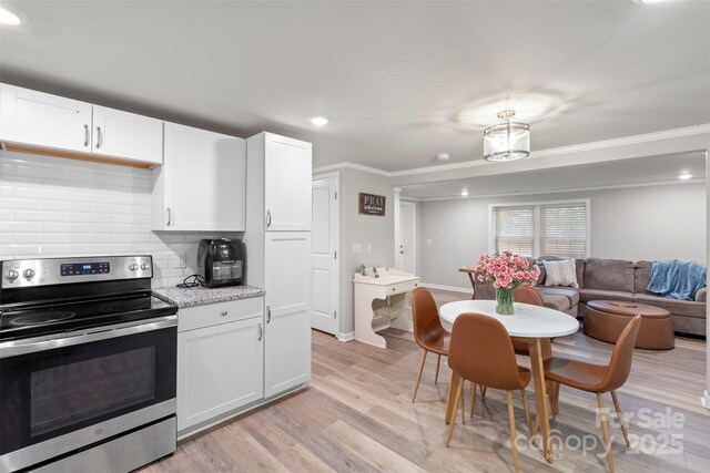 4410 Burgin St, Kannapolis, NC 28081 - kitchen featuring stainless steel electric range, backsplash, light wood-style flooring, recessed lighting, and crown molding