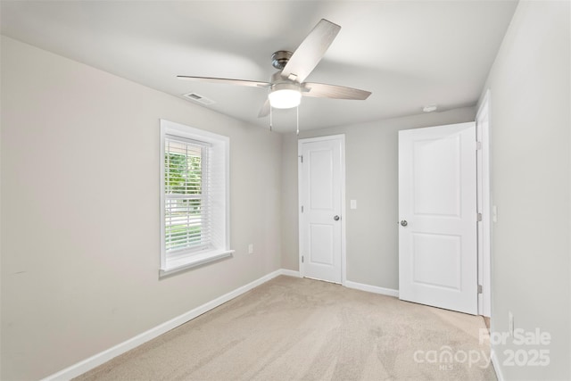 4410 Burgin St, Kannapolis, NC 28081 - unfurnished bedroom with light colored carpet and a ceiling fan