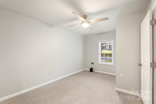 4410 Burgin St, Kannapolis, NC 28081 - unfurnished bedroom with light colored carpet and ceiling fan