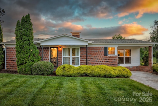 112 Meadowview Pl, Lenoir, NC 28645 - view of front of house featuring a front lawn, brick siding, and a chimney