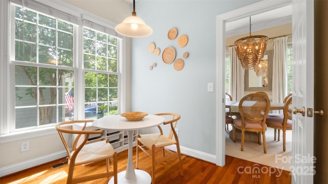 4115 Birkshire Hts, Fort Mill, SC 29708 - dining area featuring baseboards, a chandelier, and wood finished floors