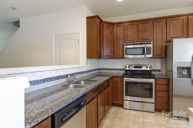 2180 Shady Pond Dr, Clover, SC 29710 - kitchen with appliances with stainless steel finishes, a sink, dark stone countertops, backsplash, and recessed lighting