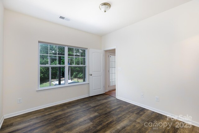 2180 Shady Pond Dr, Clover, SC 29710 - empty room with dark wood finished floors and baseboards