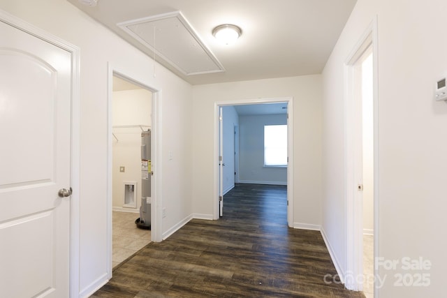2180 Shady Pond Dr, Clover, SC 29710 - hallway featuring attic access, water heater, dark wood-type flooring, and baseboards