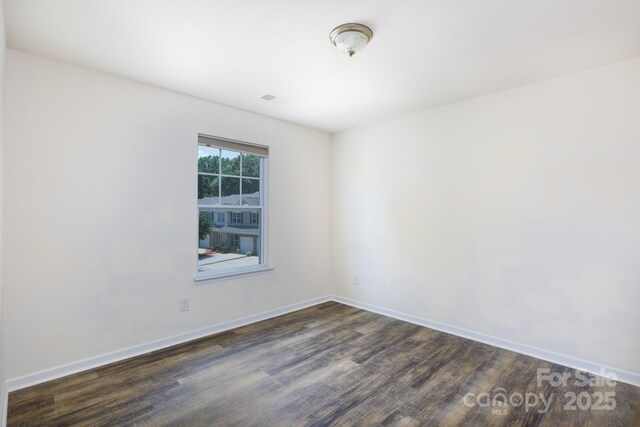2180 Shady Pond Dr, Clover, SC 29710 - spare room featuring dark wood-type flooring and baseboards