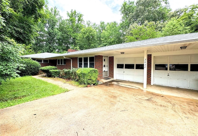 3420 Long Ferry Rd, Salisbury, NC 28146 - ranch-style home with brick siding, an attached garage, and driveway