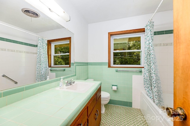 3420 Long Ferry Rd, Salisbury, NC 28146 - full bath with vanity, shower / bath combo, toilet, wainscoting, and tile walls