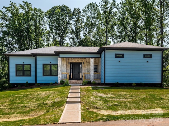 2004 Plain Field Dr, Bessemer City, NC 28016 - view of front of house featuring a front yard, a porch, and brick siding