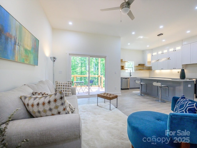2004 Plain Field Dr, Bessemer City, NC 28016 - living room featuring light wood-style flooring, recessed lighting, and a ceiling fan