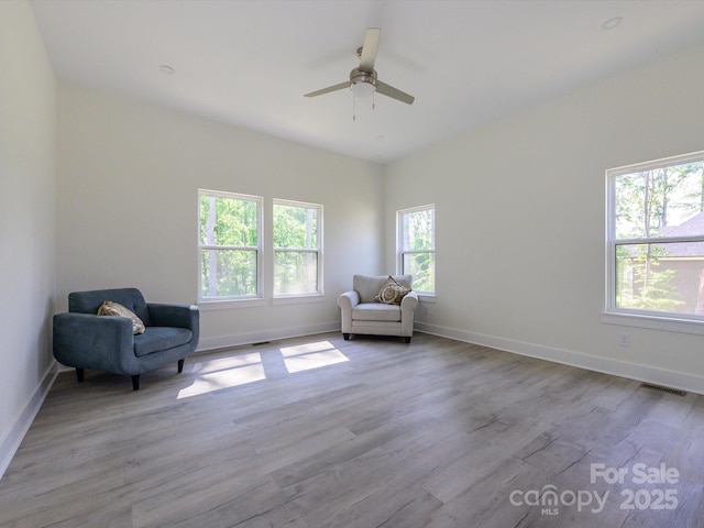 2004 Plain Field Dr, Bessemer City, NC 28016 - living area with wood finished floors, a ceiling fan, and baseboards