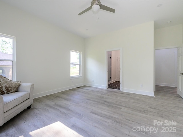2004 Plain Field Dr, Bessemer City, NC 28016 - living area with healthy amount of natural light, a ceiling fan, light wood finished floors, and baseboards