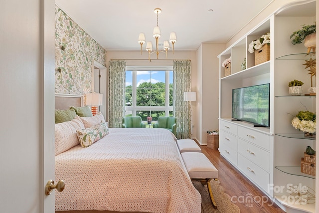 1172 Queens Rd, Charlotte, NC 28207 - bedroom featuring wallpapered walls, wood finished floors, a chandelier, and crown molding