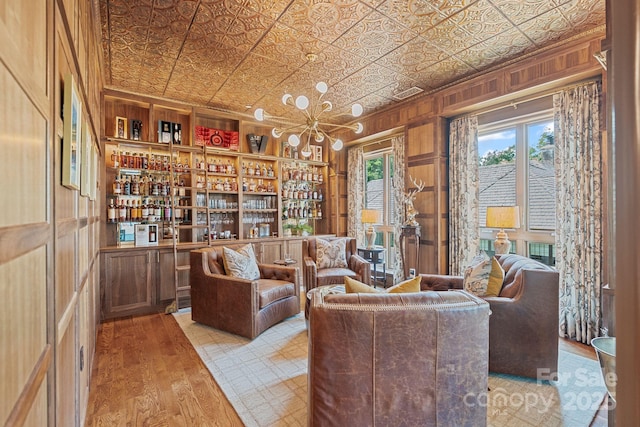 1172 Queens Rd, Charlotte, NC 28207 - sitting room featuring an ornate ceiling, wood finished floors, and wooden walls