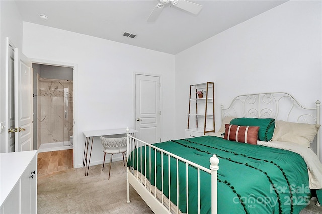 8722 Heron Glen Dr, Charlotte, NC 28269 - bedroom featuring light carpet, baseboards, connected bathroom, and a ceiling fan
