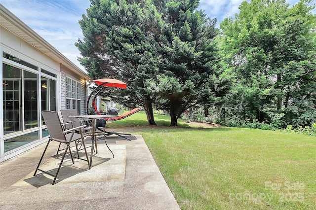 8722 Heron Glen Dr, Charlotte, NC 28269 - view of grassy yard featuring a patio area