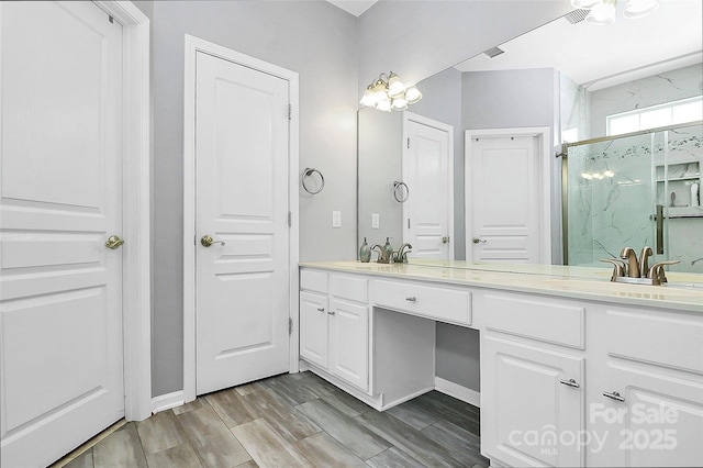 8722 Heron Glen Dr, Charlotte, NC 28269 - full bathroom featuring double vanity, a marble finish shower, wood finished floors, and baseboards