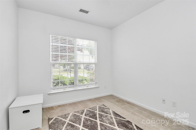 8722 Heron Glen Dr, Charlotte, NC 28269 - spare room with light colored carpet and baseboards