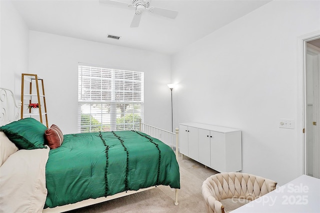 8722 Heron Glen Dr, Charlotte, NC 28269 - bedroom with light colored carpet and a ceiling fan