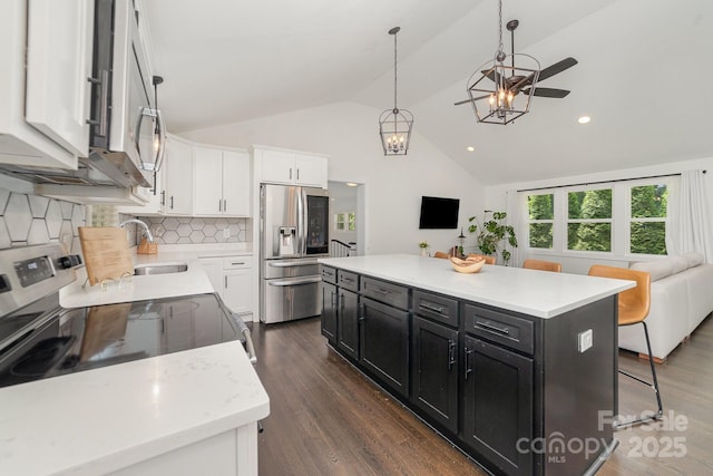 3250 Celanese Rd, Rock Hill, SC 29732 - kitchen with stainless steel appliances, dark cabinetry, a sink, open floor plan, and white cabinets