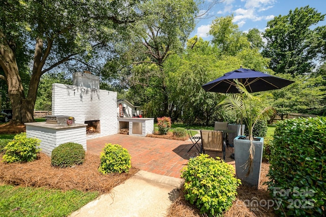 3250 Celanese Rd, Rock Hill, SC 29732 - view of patio with an outdoor brick fireplace and view of scattered trees