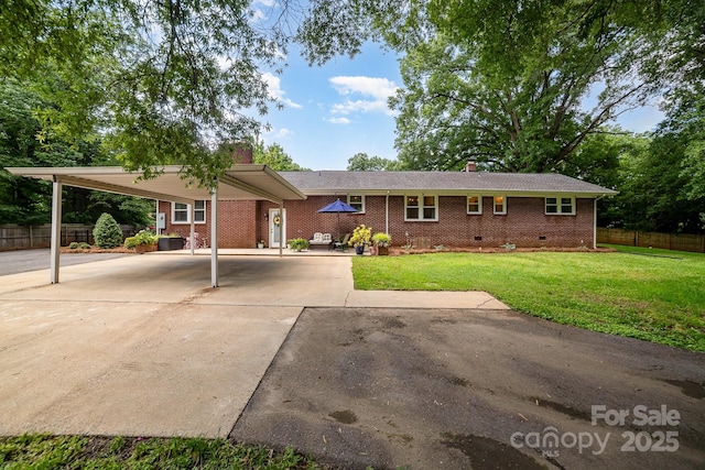 3250 Celanese Rd, Rock Hill, SC 29732 - ranch-style house with a chimney, concrete driveway, brick siding, and a carport