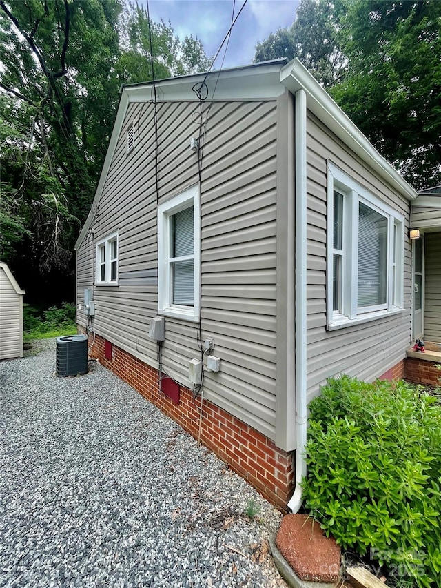 106 Peacock Ave, Lexington, NC 27292 - view of property exterior with crawl space, cooling unit, and a patio