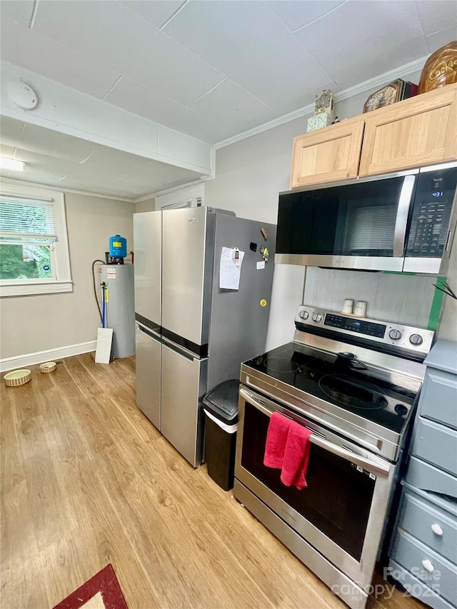 106 Peacock Ave, Lexington, NC 27292 - kitchen with stainless steel appliances, light wood-style floors, light brown cabinets, water heater, and ornamental molding