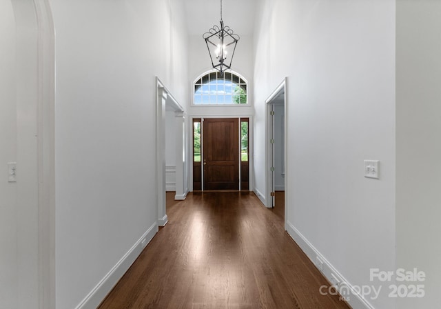 1108 Shinnecock Ln, Waxhaw, NC 28173 - entryway with a chandelier, dark wood-style floors, and a high ceiling