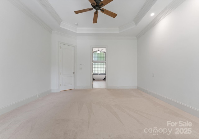 1108 Shinnecock Ln, Waxhaw, NC 28173 - empty room with ornamental molding, light carpet, ceiling fan, and a tray ceiling