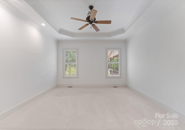 1108 Shinnecock Ln, Waxhaw, NC 28173 - unfurnished room featuring crown molding, healthy amount of natural light, light colored carpet, a raised ceiling, and ceiling fan