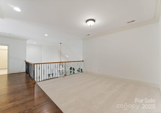 1108 Shinnecock Ln, Waxhaw, NC 28173 - spare room featuring recessed lighting, wood finished floors, and crown molding